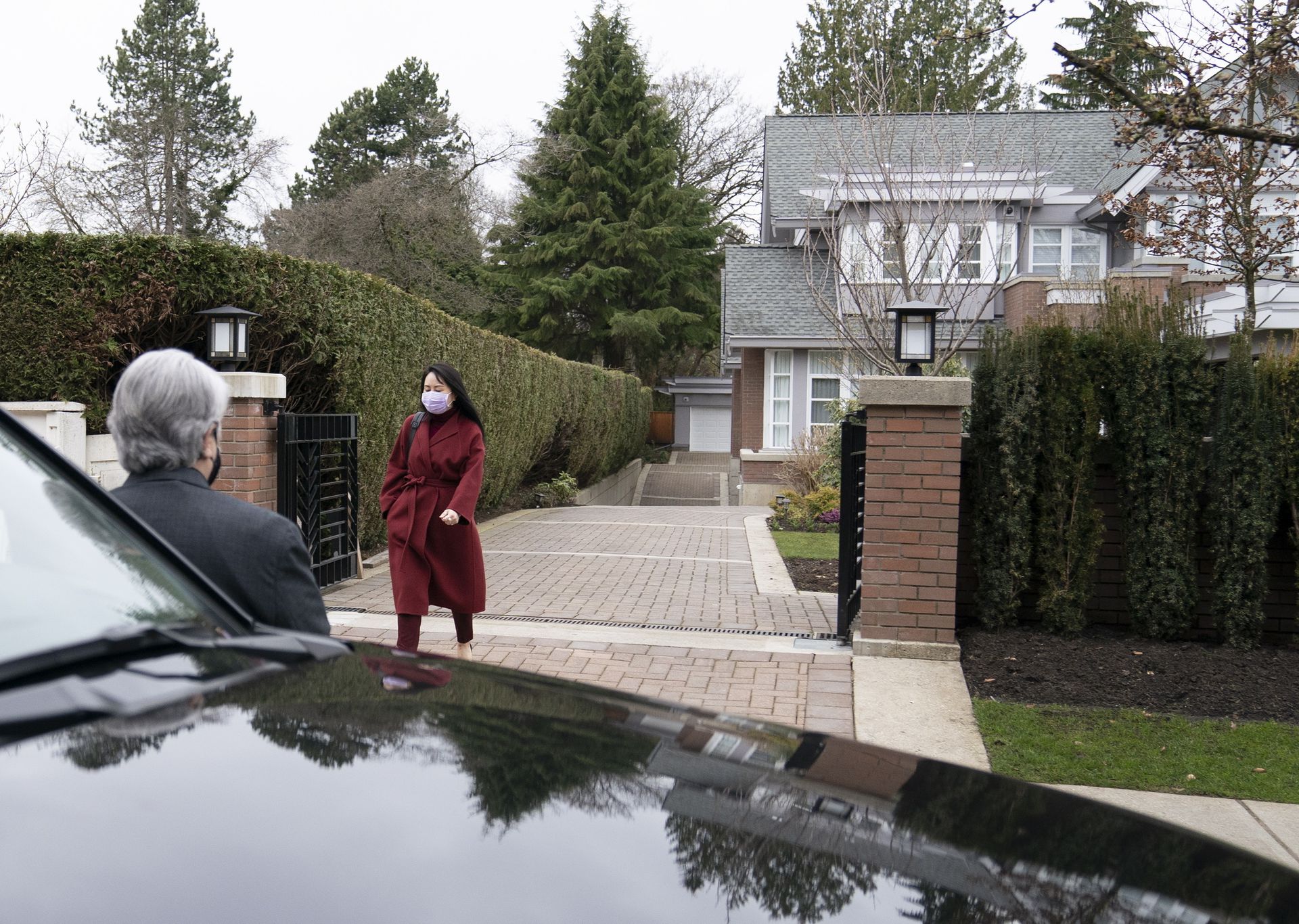 3月18日,孟晚舟离开位于温哥华的住所。(AP)